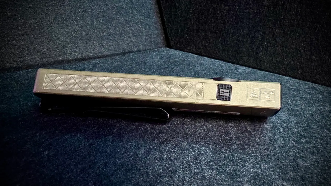 Opposite side profile of the ArkPro Ultra showing the dedicated recessed laser button and the engraved 'LASER 3R' safety marking next to the laser hazard symbol